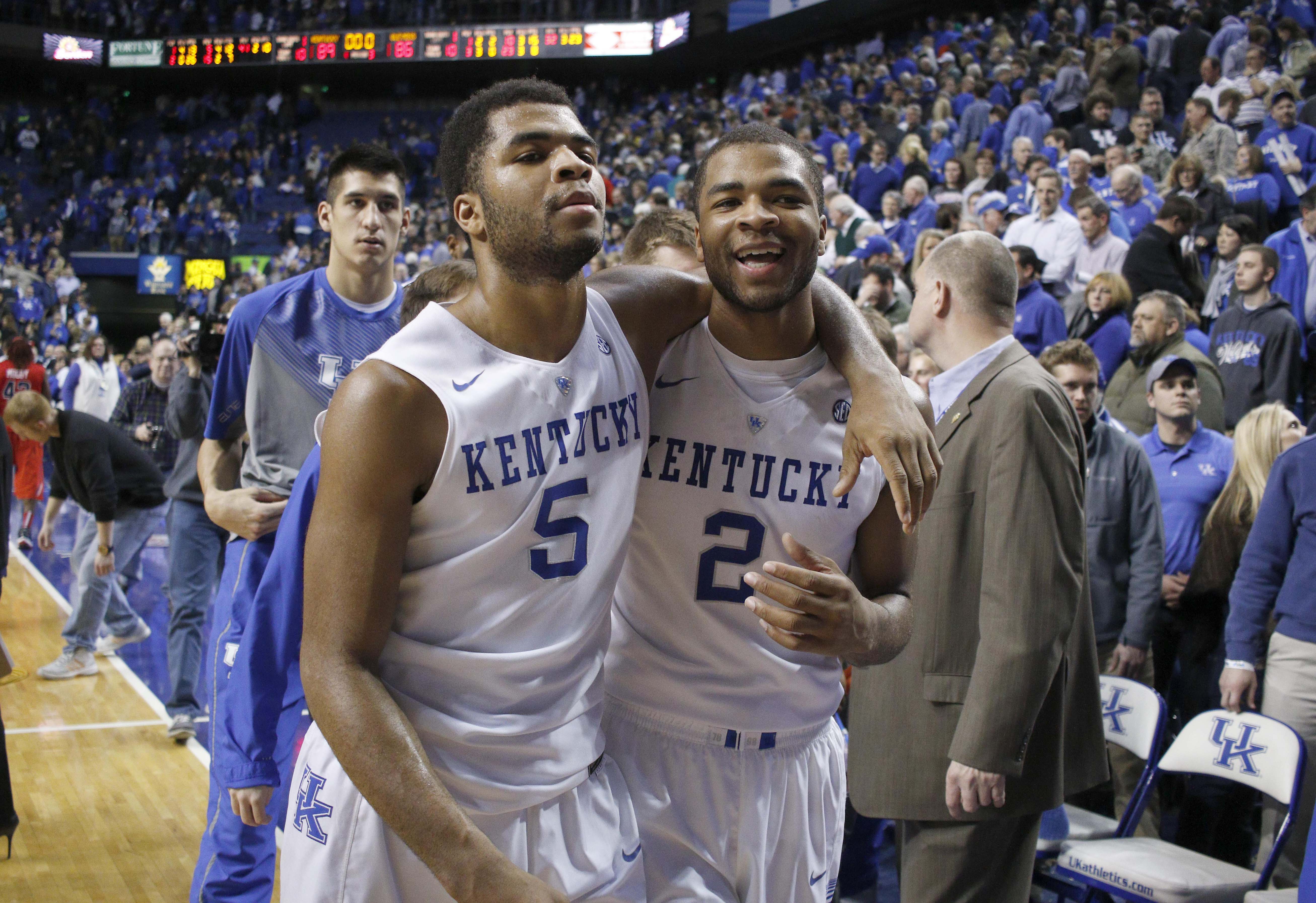 Jan 6, 2015; Lexington, KY, USA; Kentucky Wildcats guard Aaron Harrison (2) and guard Andrew Harrison (5) celebrate after the overtime win against the Mississippi Rebels at Rupp Arena. Mandatory Credit: Mark Zerof-USA TODAY Sports
