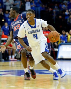 Dec 31, 2014; Newark, NJ, USA;  Seton Hall Pirates guard Sterling Gibbs (4) brings the ball up court during the second half against St. John's Red Storm guard Rysheed Jordan (23) at the Prudential Center. Seton Hall Pirates defeat St. John's Red Storm 78-67. Mandatory Credit: Jim O'Connor-USA TODAY Sports
