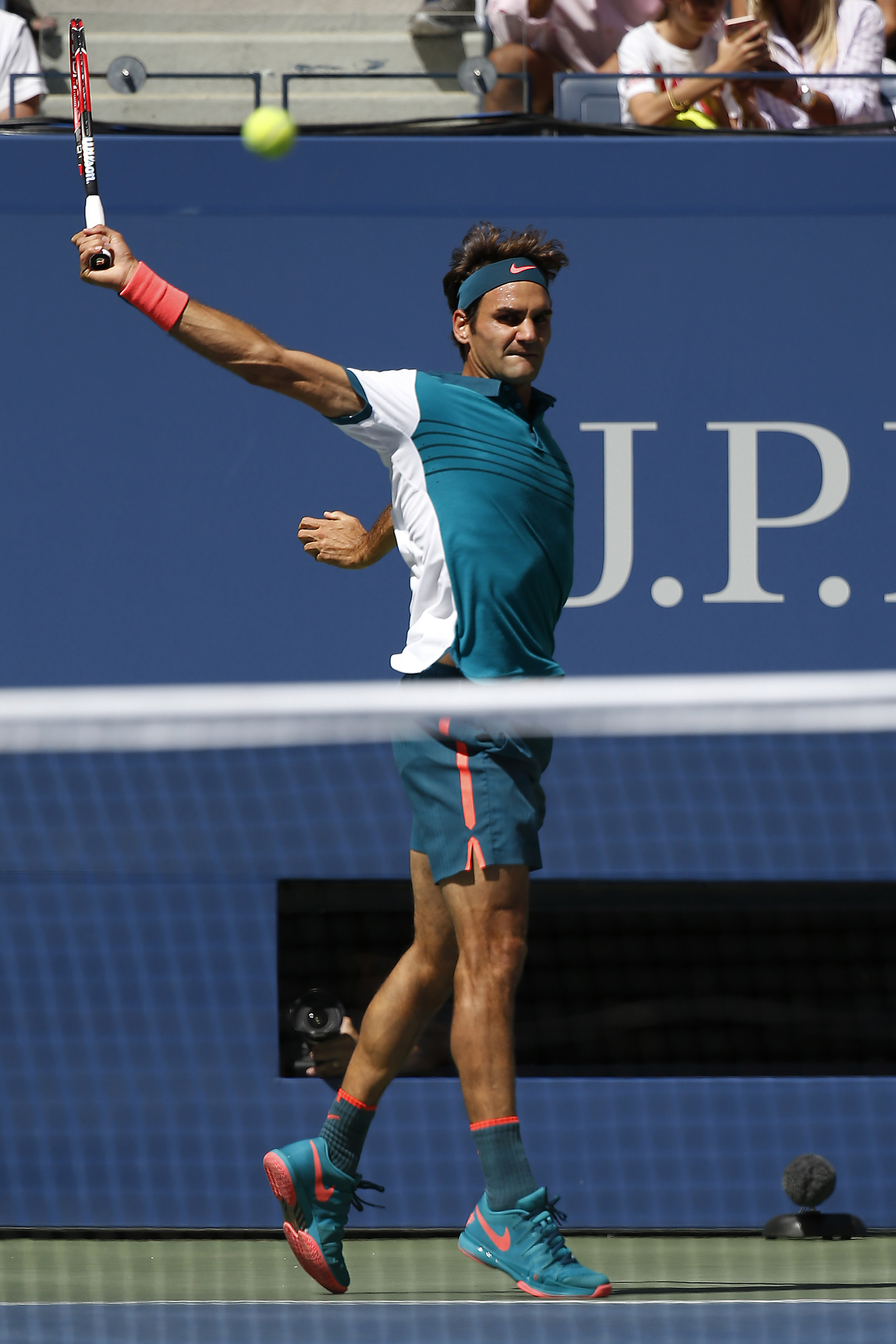 Sep 5, 2015; New York, NY, USA; Roger Federer of Swizterland hits a backhand against Philipp Kohlschreiber of Germany (not pictured) on day six of the 2015 U.S. Open tennis tournament at USTA Billie Jean King National Tennis Center. Mandatory Credit: Geoff Burke-USA TODAY Sports
