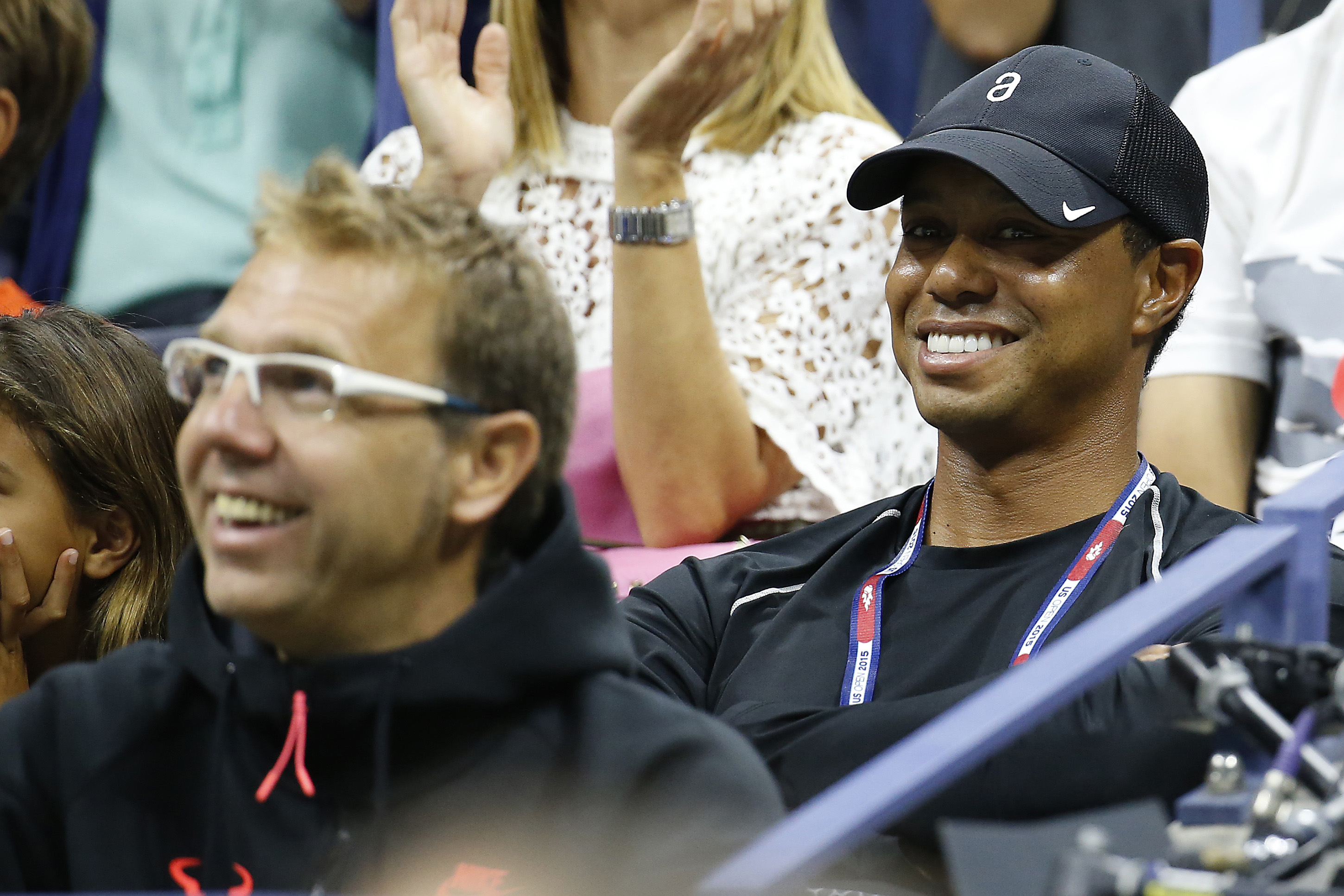 Sep 4, 2015; New York, NY, USA; PGA golfer Tiger Woods (R) watches from the player's box of Rafael Nadal of Spain (not pictured) against Fabio Fognini of Italy (not pictured) on day five of the 2015 U.S. Open tennis tournament at USTA Billie Jean King National Tennis Center. Mandatory Credit: Geoff Burke-USA TODAY Sports