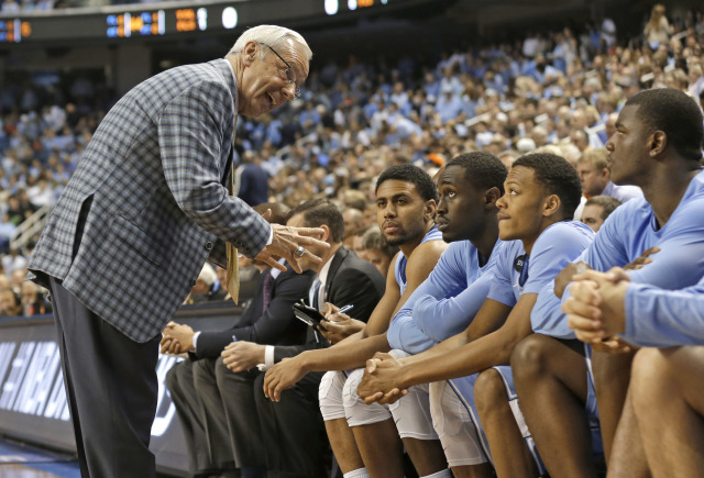 North Carolina head coach Roy Williams talks to his team during the second half of an NCAA college basketball game against Notre Dame in the championship of the Atlantic Coast Conference tournament Saturday, March 14, 2015, in Greensboro, N.C.  (AP Photo/Gerry Broome)