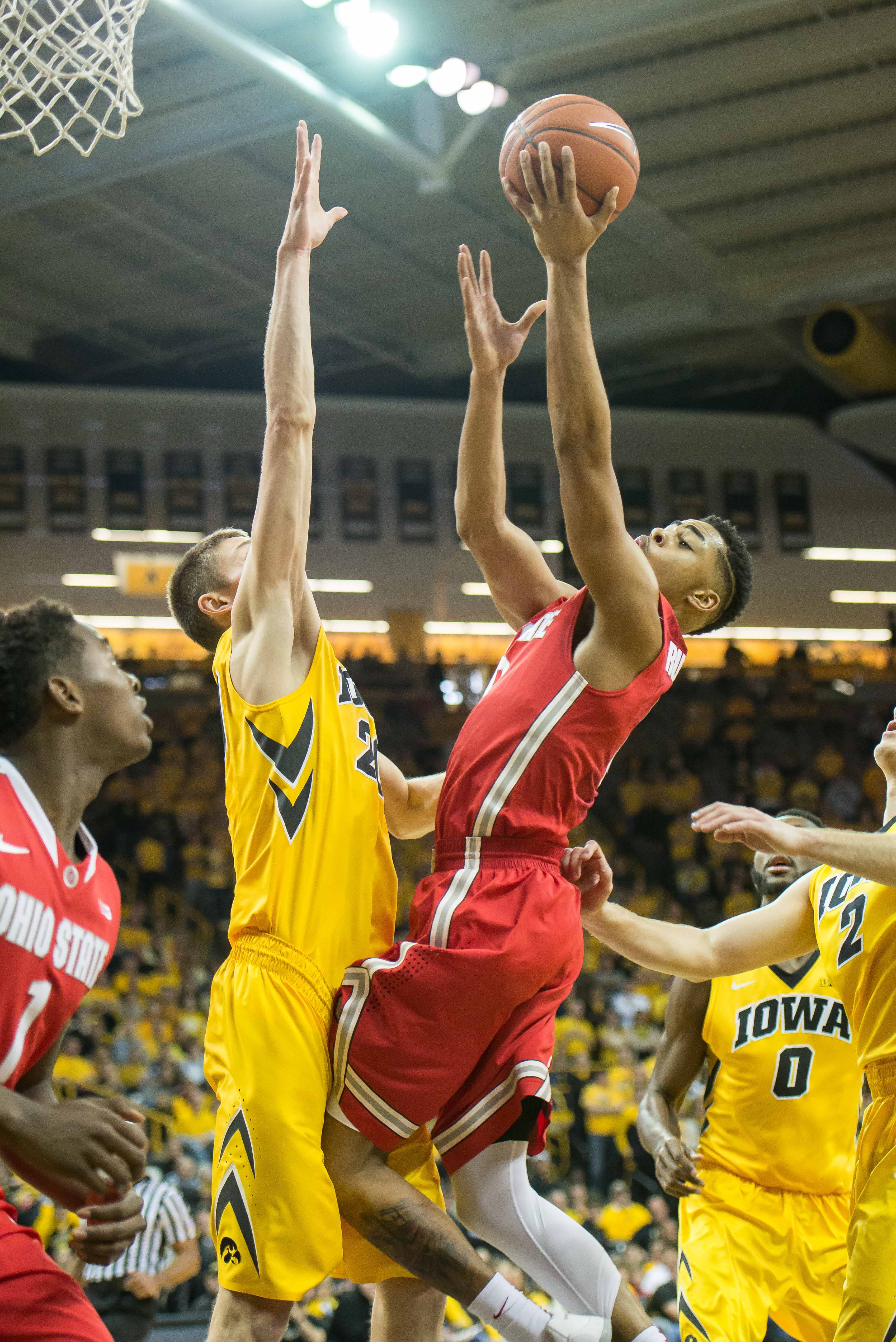 Jan 17, 2015; Iowa City, IA, USA; Ohio State Buckeyes guard D'Angelo Russell (0) goes to the basket against Iowa Hawkeyes forward Jarrod Uthoff (20) during the first half at Carver-Hawkeye Arena. Mandatory Credit: Jeffrey Becker-USA TODAY Sports